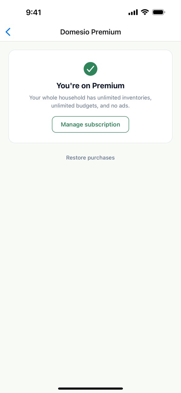 The Domesio Premium screen: You're on Premium, Manage subscription, and Restore purchases
